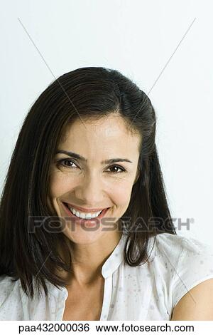 Woman smiling at camera, head and shoulders, portrait View Large Photo Image Stock Photograph - Woman smiling at camera, head and shoulders, portrait. Fotosearch