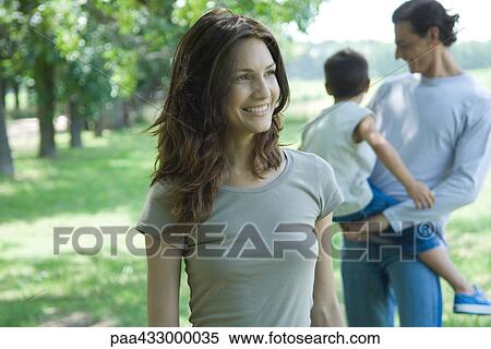 Family standing outside, focus on mother in foreground View Large Photo Image Stock Photography - Family standing outside, focus on mother in foreground. Fotosearch