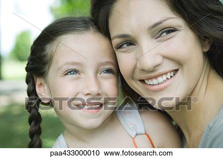 Woman and daughter, portrait View Large Photo Image Stock Image - Woman and daughter, portrait. Fotosearch