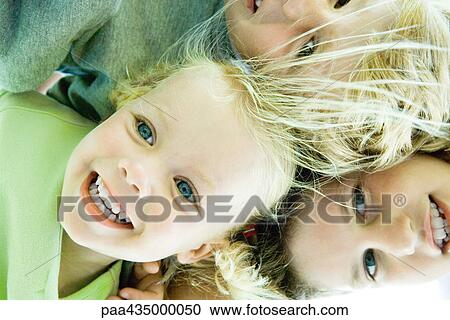 Children huddling, low angle view View Large Photo Image Stock Image - Children huddling, low angle view. Fotosearch