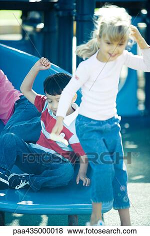 Children on playground equipment, smiling View Large Photo Image Stock Photo - Children on playground equipment, smiling. Fotosearch