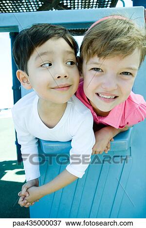 Children on playground equipment, smiling at camera View Large Photo Image Stock Photo - Children on playground equipment, smiling at camera. Fotosearch