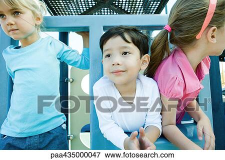 Stock Photo - Children on playground equipment. Fotosearch