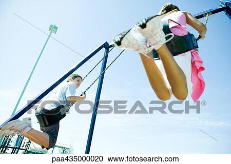 Children on playground swings View Large Photo Image Stock Image - Children on playground swings. Fotosearch