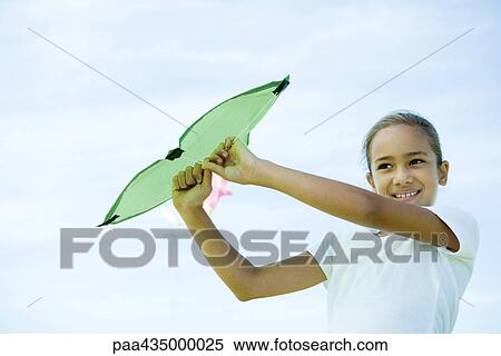 Girl holding up kite View Large Photo Image Stock Photography - Girl holding up kite. Fotosearch