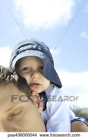 carrying baby on shoulders