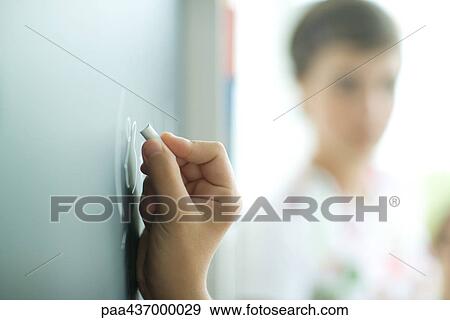 Hand writing on chalkboard, extreme close-up View Large Photo Image Stock Photo - Hand writing on chalkboard, extreme close-up. Fotosearch