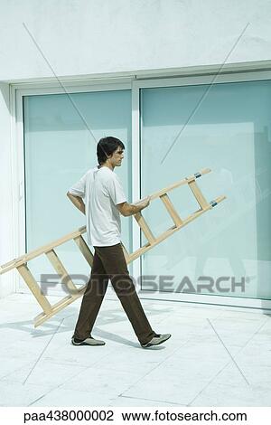 Man carrying ladder, full length View Large Photo Image Stock Image - Man carrying ladder, full length. Fotosearch