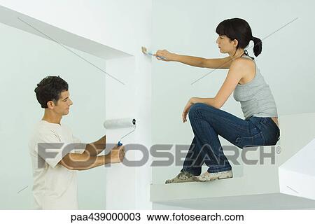 Man and woman painting home interior View Large Photo Image Stock Image - Man and woman painting home interior. Fotosearch