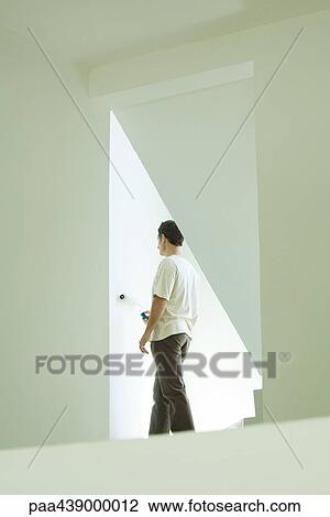 Man painting wall with roller View Large Photo Image Stock Image - Man painting wall with roller. Fotosearch