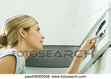 Woman looking at fuse box View Large Photo Image Stock Photo - Woman looking at fuse box. Fotosearch