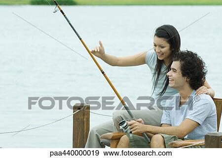 Couple fishing on pier View Large Photo Image Stock Photo - Couple fishing on pier. Fotosearch