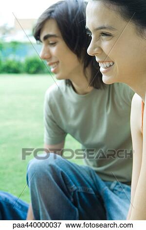 Teenage couple laughing View Large Photo Image Stock Photo - Teenage couple laughing. Fotosearch