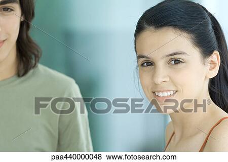 Teenage friends, smiling at camera View Large Photo Image Stock Photo - Teenage friends, smiling at camera. Fotosearch