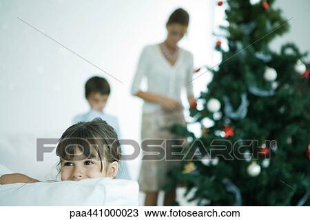 Family decorating Christmas tree View Large Photo Image Stock Image - Family decorating Christmas tree. Fotosearch