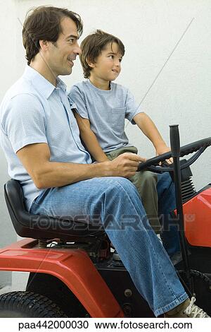 Father and son on riding lawnmower View Large Photo Image Stock Image - Father and son on riding lawnmower. Fotosearch