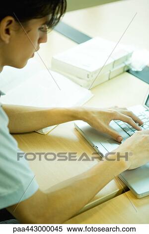 Male college student using laptop View Large Photo Image Stock Photography - Male college student using laptop. Fotosearch