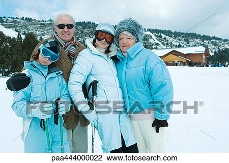 Grandparents and grandchildren standing in snowy landscape, portrait View Large Photo Image Stock Image - Grandparents and grandchildren standing in snowy landscape, portrait. Fotosearch