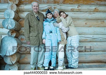 Grandparents and grandchildren standing by log cabin, full length portrait View Large Photo Image Stock Image - Grandparents and grandchildren standing by log cabin, full length portrait. Fotosearch