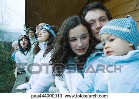 Group of skiers standing next to chalet View Large Photo Image Stock Image - Group of skiers standing next to chalet. Fotosearch