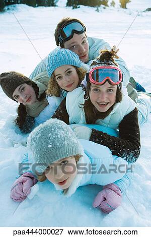 Young friends in snow, portrait View Large Photo Image Stock Photo - Young friends in snow, portrait. Fotosearch