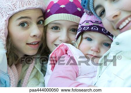 Young siblings wearing winter clothing, portrait View Large Photo Image Stock Image - Young siblings wearing winter clothing, portrait. Fotosearch