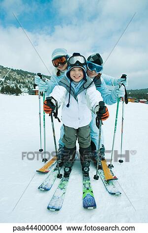 Young skiers, full length portrait View Large Photo Image Picture - Young skiers, full length portrait. Fotosearch