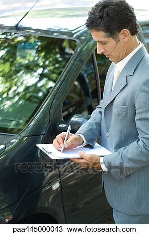 Insurance adjuster inspecting car Stock Image | paa445000043 | Fotosearch