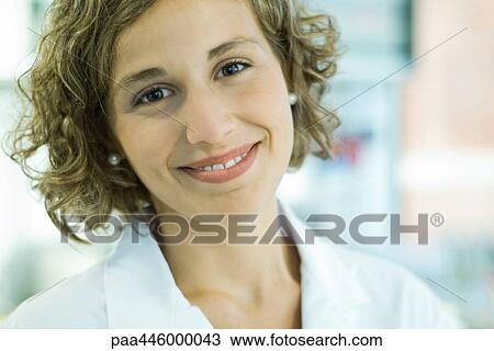 Female doctor smiling, portrait View Large Photo Image Stock Image - Female doctor smiling, portrait. Fotosearch