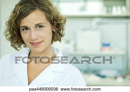 Female doctor smiling, portrait View Large Photo Image Stock Photo - Female doctor smiling, portrait. Fotosearch