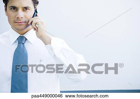Businessman using cell phone View Large Photo Image Stock Photograph - Businessman using cell phone. Fotosearch