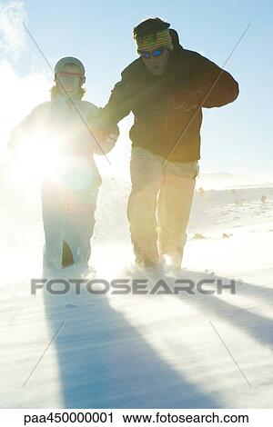 Father and daughter running in snow, dressed in winter clothing, full length View Large Photo Image Stock Image - Father and daughter running in snow, dressed in winter clothing, full length. Fotosearch