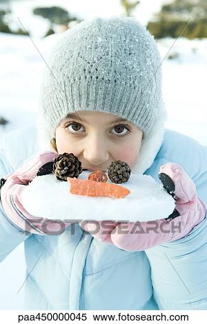 Girl biting into snow, looking at camera, portrait View Large Photo Image Stock Photography - Girl biting into snow, looking at camera, portrait. Fotosearch