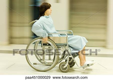 Woman using wheelchair, full length, blurred motion View Large Photo Image Stock Photo - Woman using wheelchair, full length, blurred motion. Fotosearch