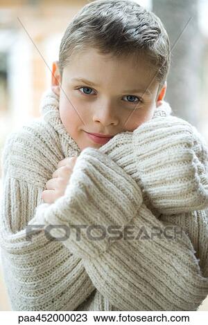 Boy wearing thick wool sweater, portrait View Large Photo Image Stock Image - Boy wearing thick wool sweater, portrait. Fotosearch