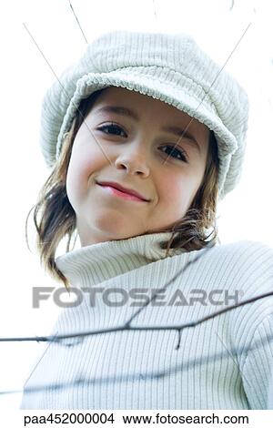 Picture - Girl wearing cap, portrait. Fotosearch