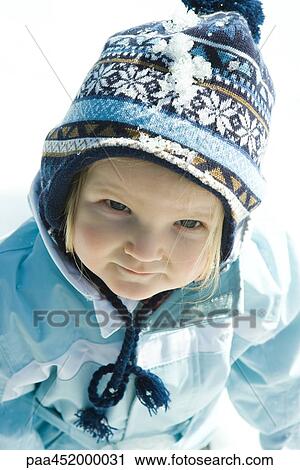 Toddler girl wearing winter clothes in snow, portrait View Large Photo Image Stock Image - Toddler girl wearing winter clothes in snow, portrait. Fotosearch