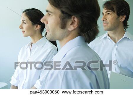 Three business associates looking away, side view, head and shoulders View Large Photo Image Stock Image - Three business associates looking away, side view, head and shoulders. Fotosearch