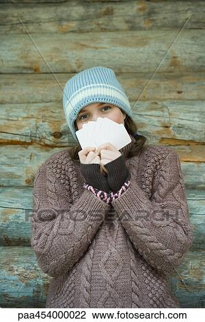 Teenage girl looking over cards, dressed in winter clothing, portrait View Large Photo Image Stock Image - Teenage girl looking over cards, dressed in winter clothing, portrait. Fotosearch