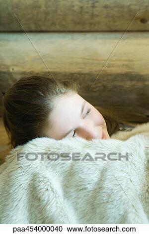 Teenage girl resting head on blanket, smiling View Large Photo Image Stock Image - Teenage girl resting head on blanket, smiling. Fotosearch
