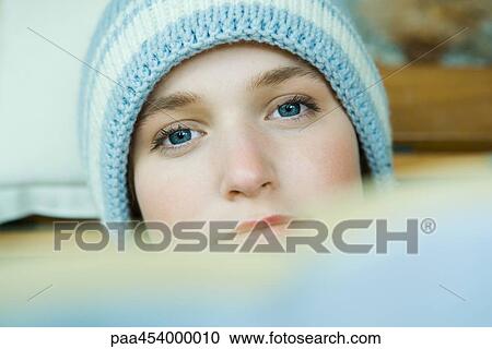 Teenage girl wearing knit hat, looking at camera, head View Large Photo Image Stock Image - Teenage girl wearing knit hat, looking at camera, head. Fotosearch