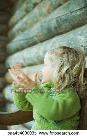 Toddler girl clapping hands, side view, blurred motion View Large Photo Image Stock Photography - Toddler girl clapping hands, side view, blurred motion. Fotosearch