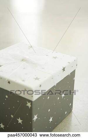 Christmas gift, on floor, close-up View Large Photo Image Stock Image - Christmas gift, on floor, close-up. Fotosearch