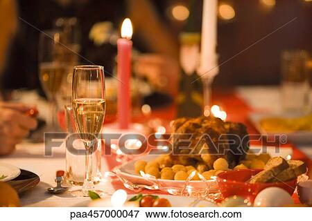 Festive meal on dinner table, cropped view View Large Photo Image Stock Photo - Festive meal on dinner table, cropped view. Fotosearch