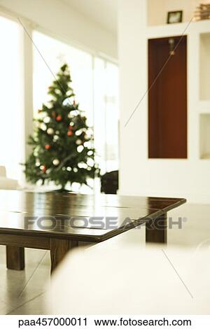 Home interior, Christmas tree in background View Large Photo Image Stock Image - Home interior, Christmas tree in background. Fotosearch