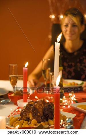 Woman eating candle lit dinner, selective focus View Large Photo Image Stock Photo - Woman eating candle lit dinner, selective focus. Fotosearch