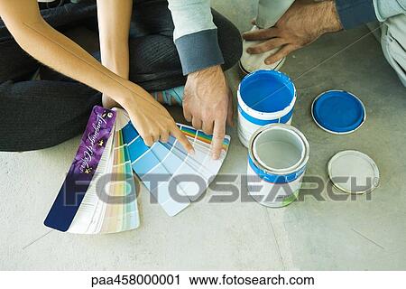 Couple sitting on floor, pointing to color swatches, cropped view View Large Photo Image Stock Image - Couple sitting on floor, pointing to color swatches, cropped view. Fotosearch