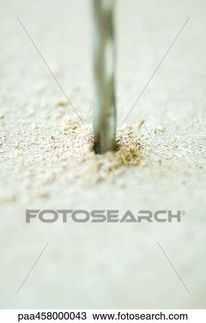 Drill bit drilling hole, close-up View Large Photo Image Stock Image - Drill bit drilling hole, close-up. Fotosearch