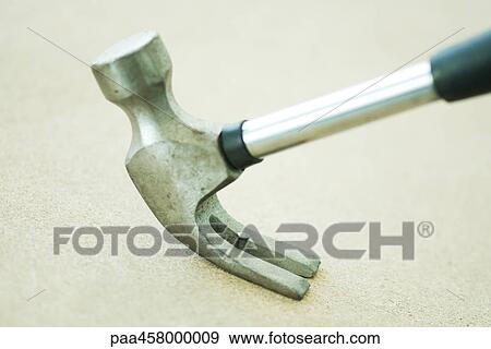 Hammer removing nail, close-up View Large Photo Image Stock Photo - Hammer removing nail, close-up. Fotosearch