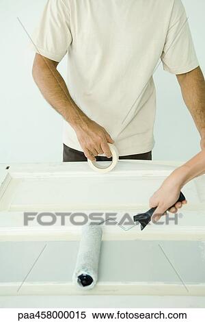 Man and woman painting door, cropped view View Large Photo Image Stock Photography - Man and woman painting door, cropped view. Fotosearch